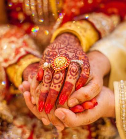 Indian wedding hands with gold